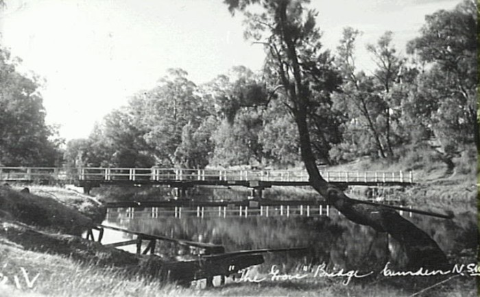 Little Sandy with footbridge across the Nepean River at Camden c.1950. This area on the Nepean River was always a popular swimming spot. Diving board in foreground. (Camden Images)